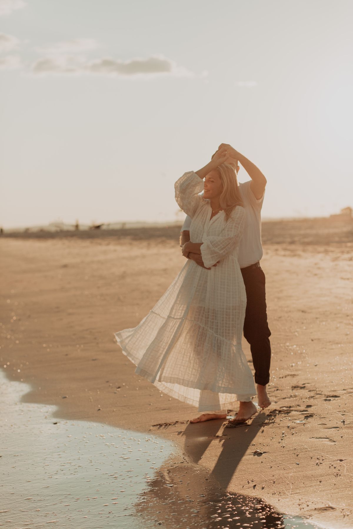Sample photograph of a couple dancing on the beach